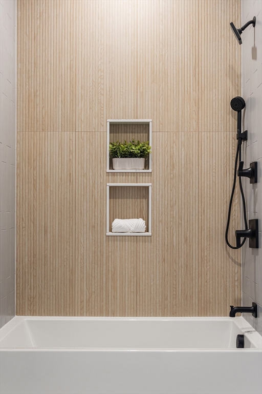 140 Shirley Street, Unit 204 Winthrop, MA 02152 - Photo 11 of 21 a bathroom with a bathtub and a shower