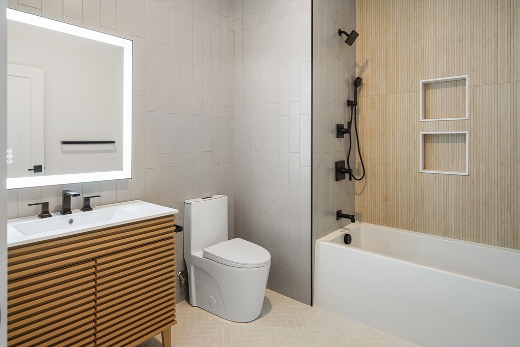 140 Shirley Street, Unit 204 Winthrop, MA 02152 - Photo 14 of 21 a bathroom with a sink toilet and shower