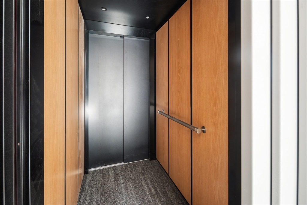 140 Shirley Street, Unit 204 Winthrop, MA 02152 - Photo 17 of 21 a view of a hallway with wooden floor