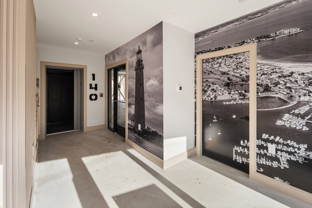 140 Shirley Street, Unit 204 Winthrop, MA 02152 - Photo 18 of 21 a view of a hallway with wooden floor and living room