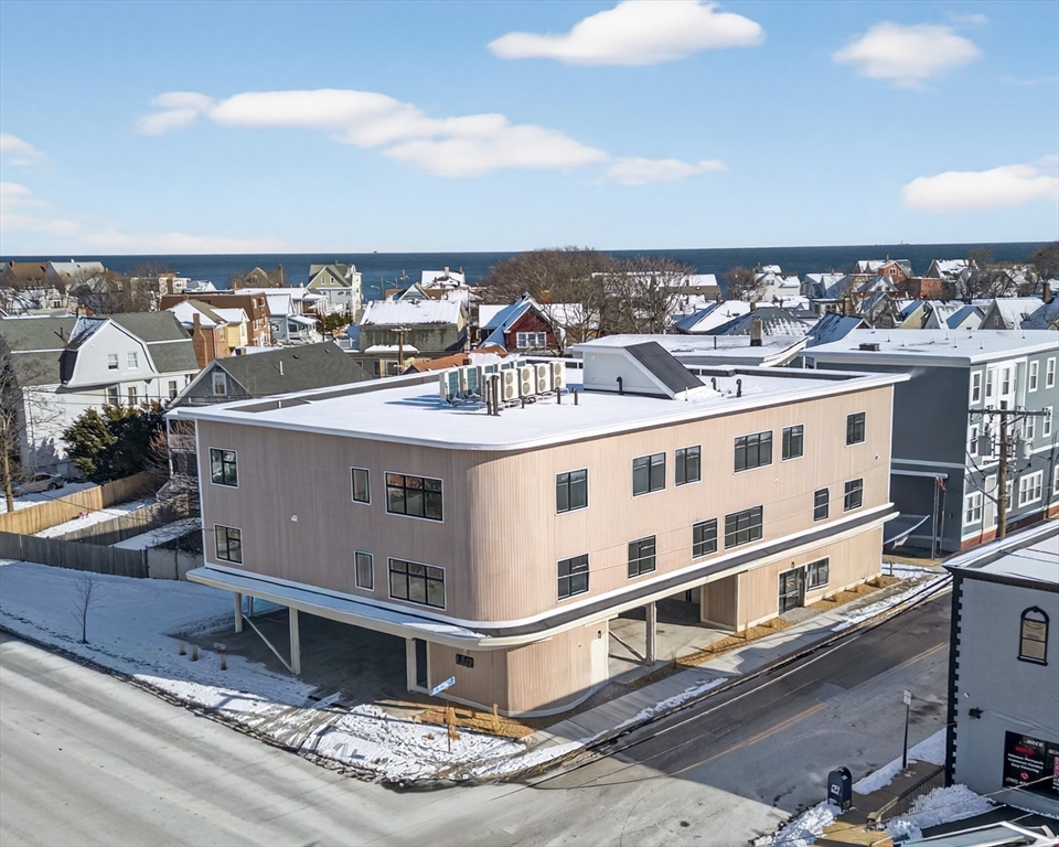 140 Shirley Street, Unit 204 Winthrop, MA 02152 - Photo 20 of 21 a view of a white building with glass windows