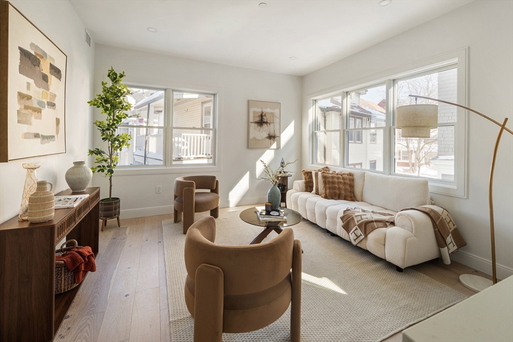 140 Shirley Street, Unit 204 Winthrop, MA 02152 - Photo 6 of 21 a living room with furniture and a large window