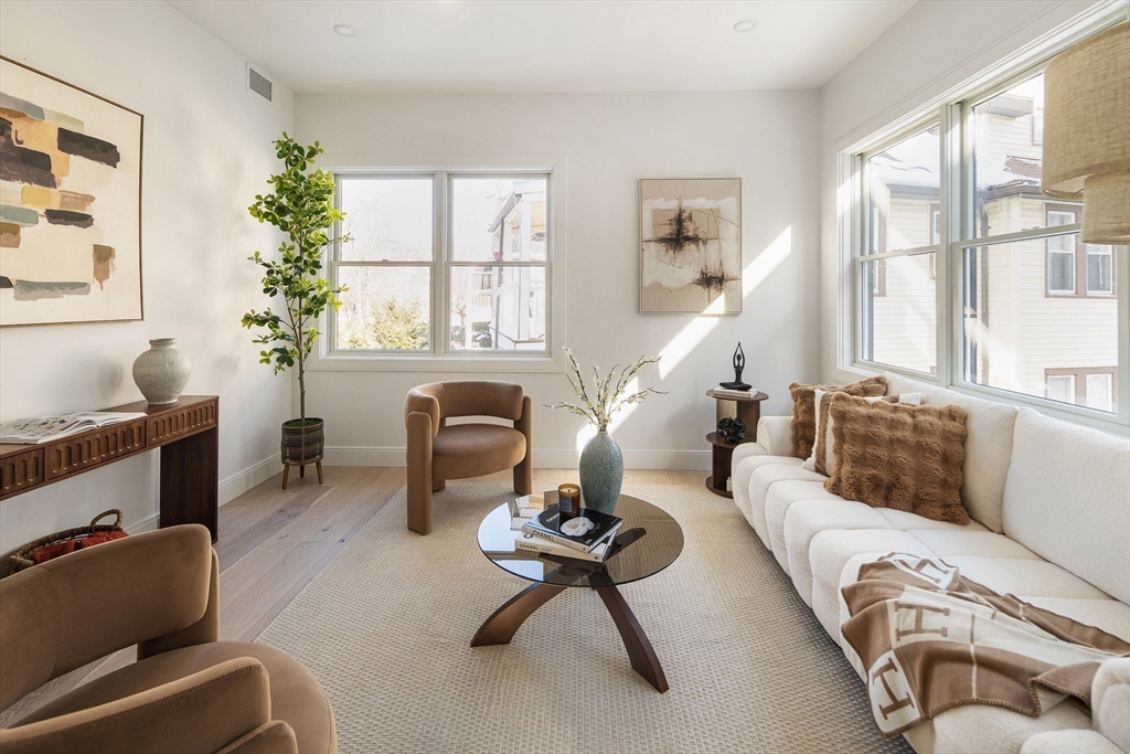140 Shirley Street, Unit 204 Winthrop, MA 02152 - Photo 7 of 21 a living room with furniture and a large window