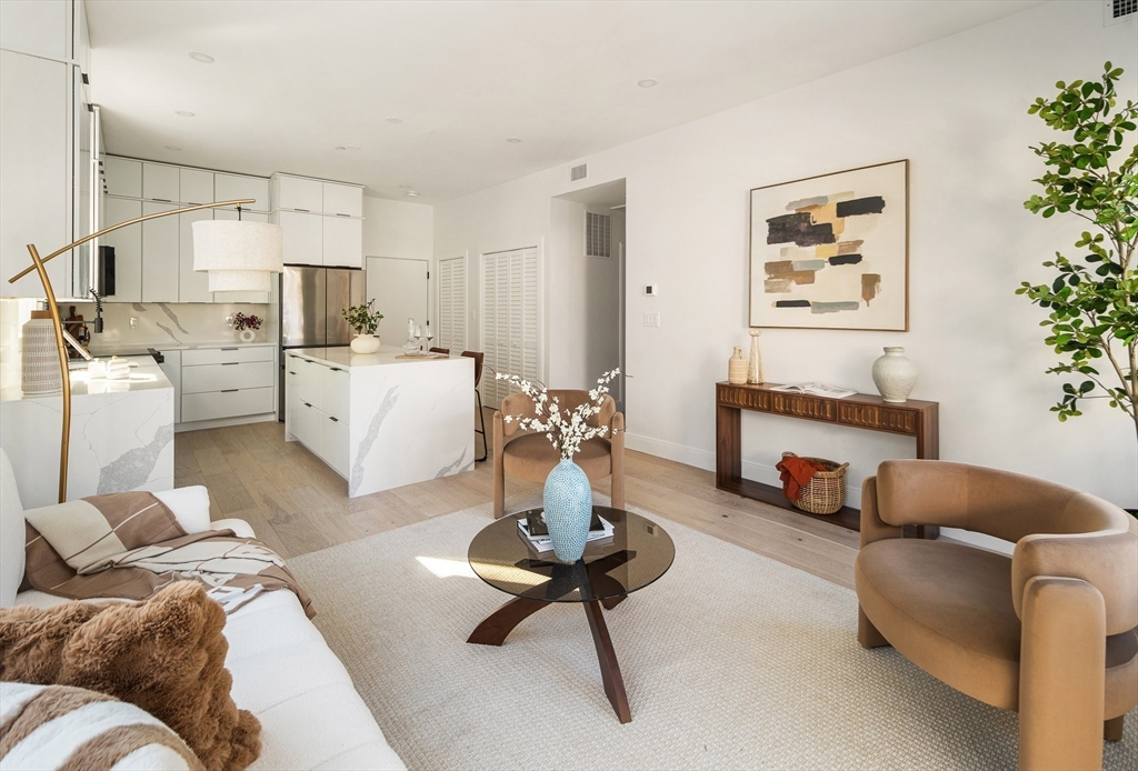 140 Shirley Street, Unit 204 Winthrop, MA 02152 - Photo 8 of 21 a living room with furniture or couch and a dining table