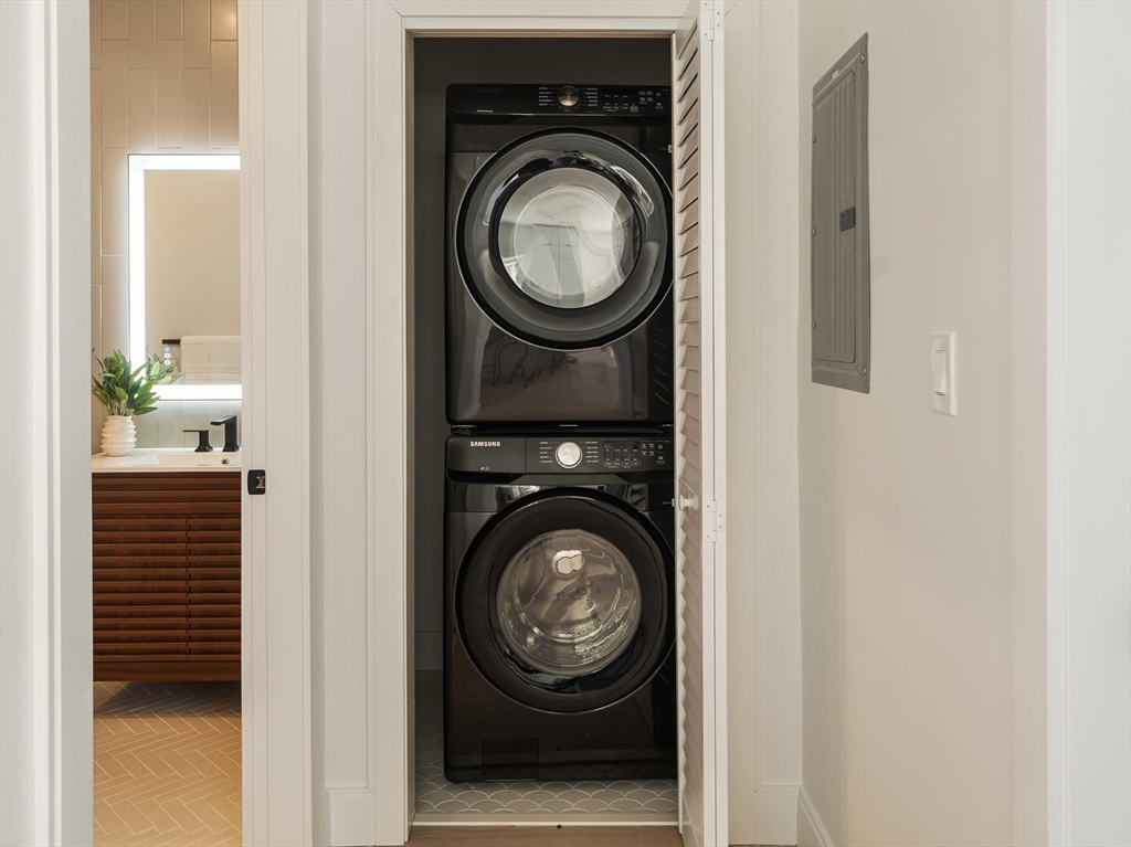 140 Shirley Street, Unit 204 Winthrop, MA 02152 - Photo 9 of 21 a view of washer and dryer in a utility room