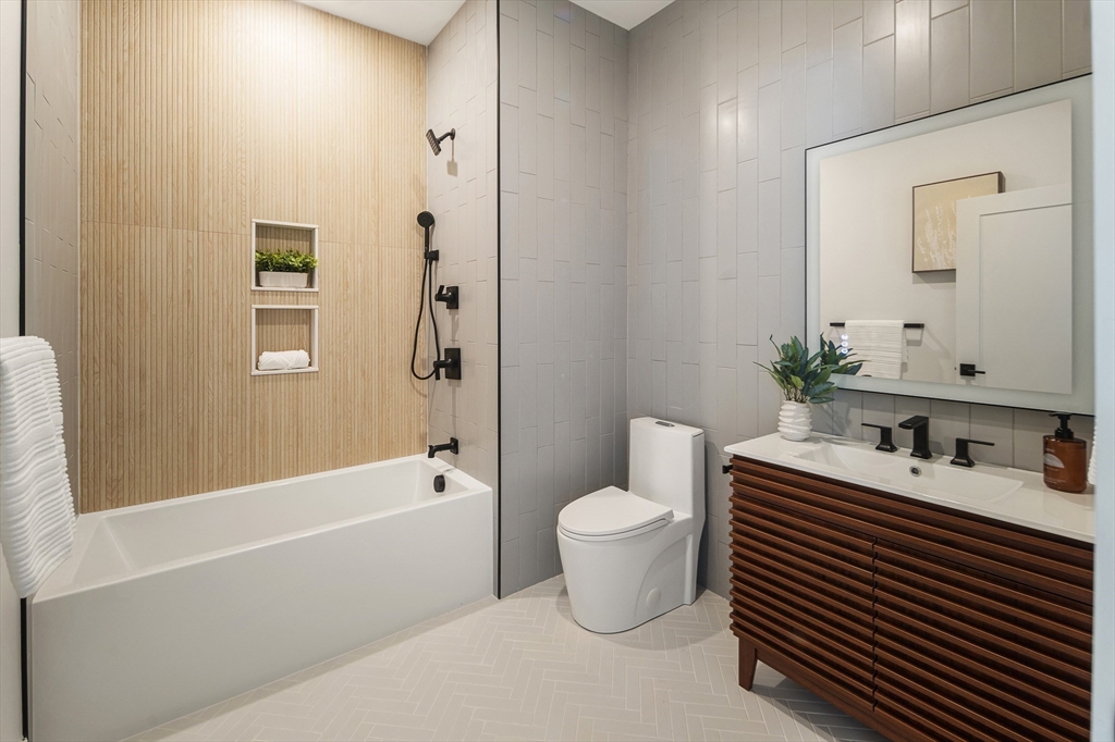 140 Shirley Street, Unit 204 Winthrop, MA 02152 - Photo 10 of 21 a bathroom with a sink toilet and shower