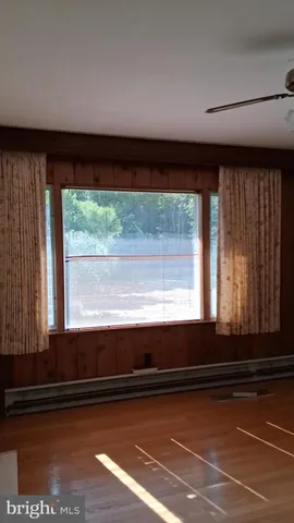 a bathroom with a granite countertop toilet and a shower
