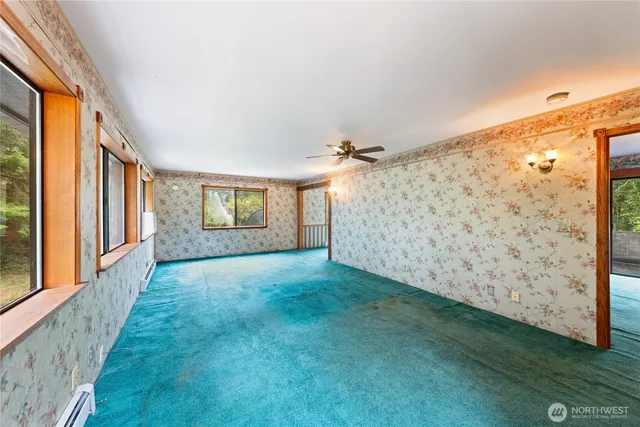a view of a room with wooden floor and iron gate