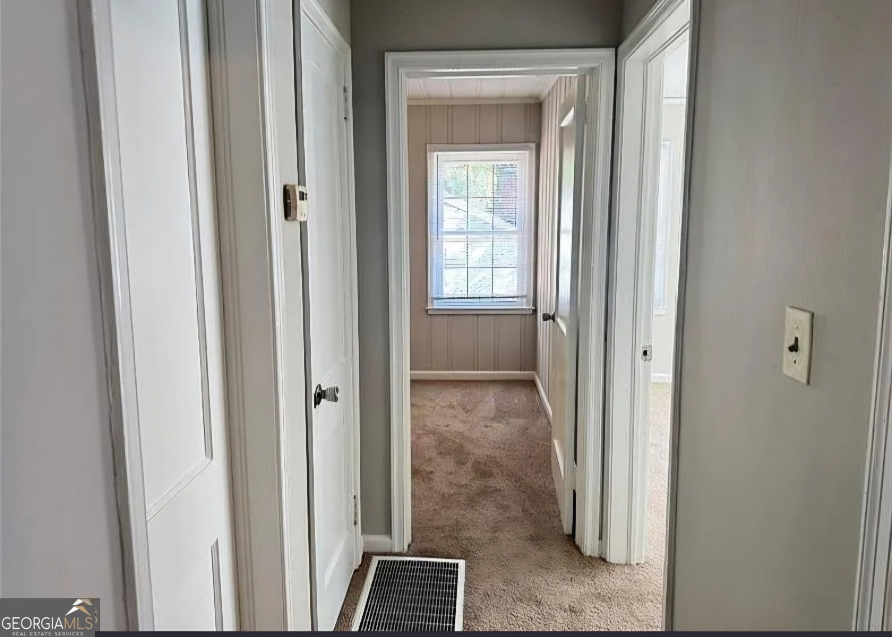 1589 Pinehurst Drive Southwest Atlanta, GA 30311 - Photo 6 of 10 a view of a bathroom from a corridor