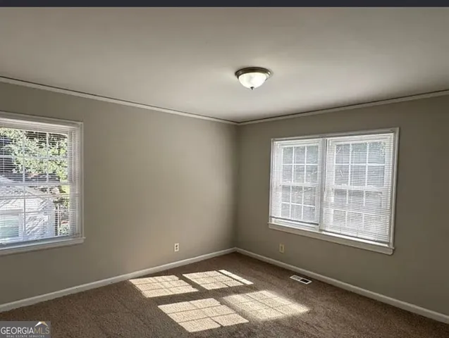 an empty room with windows