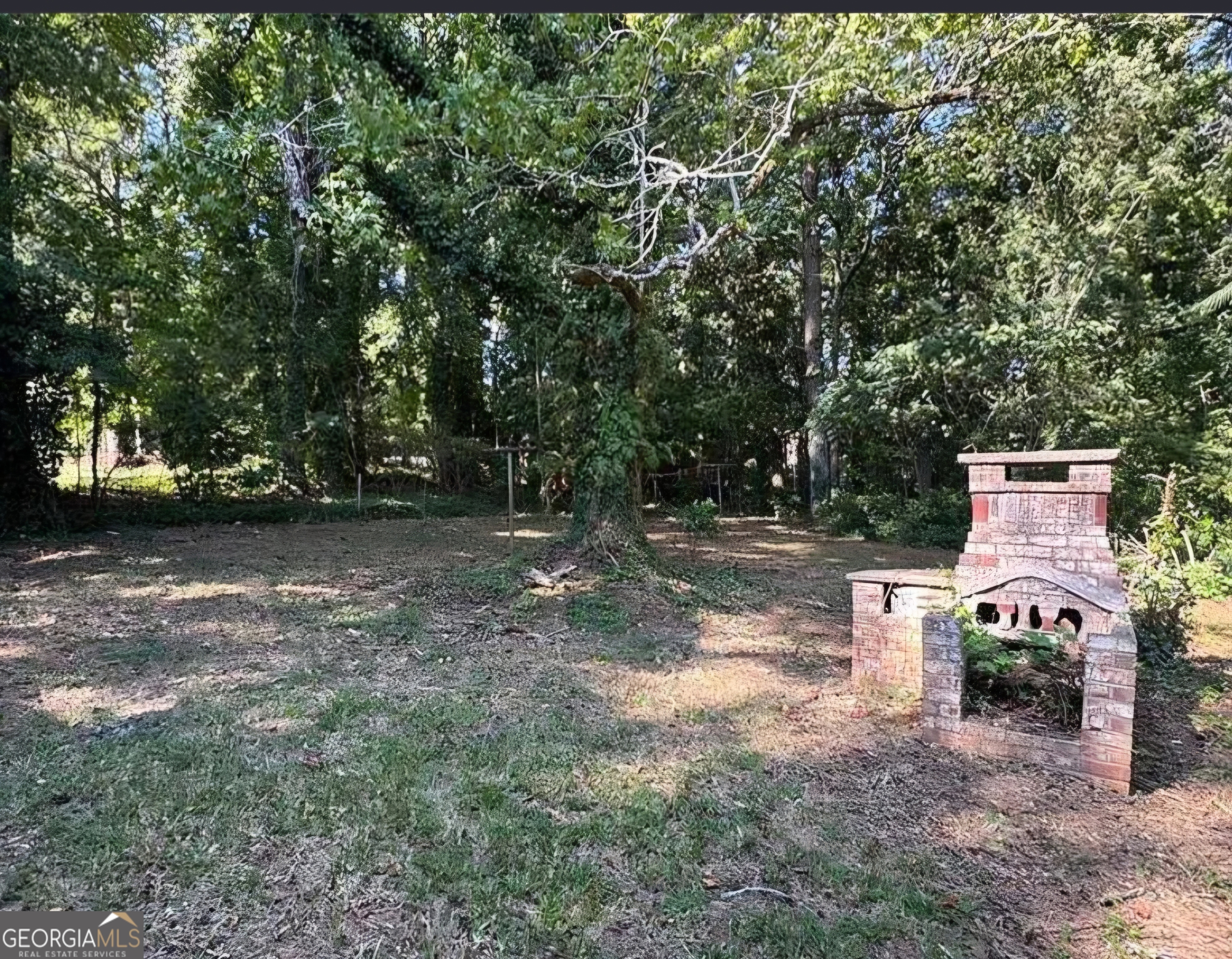 1589 Pinehurst Drive Southwest Atlanta, GA 30311 - Photo 9 of 10 a view of backyard with a table and chair