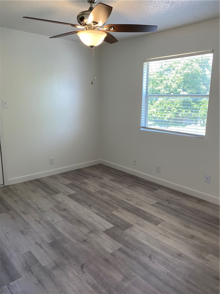 2305 Cedrick Cove, Unit D Austin, TX 78748 - Photo 16 of 39 Bedroom 1 with ceiling fan, 2 closets and back balcony