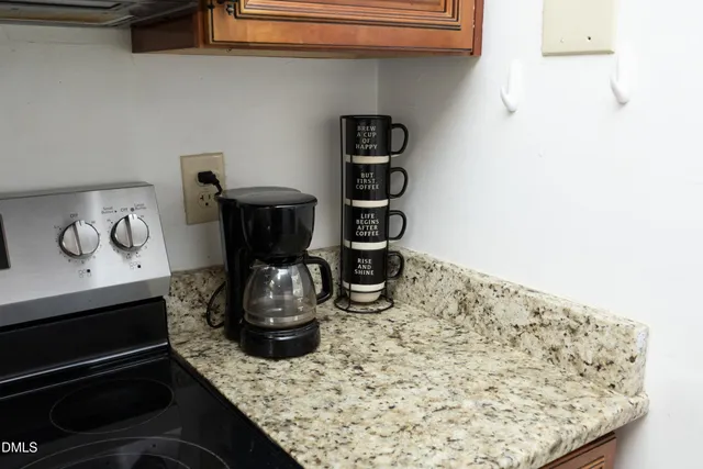 a kitchen with a stove and cabinets