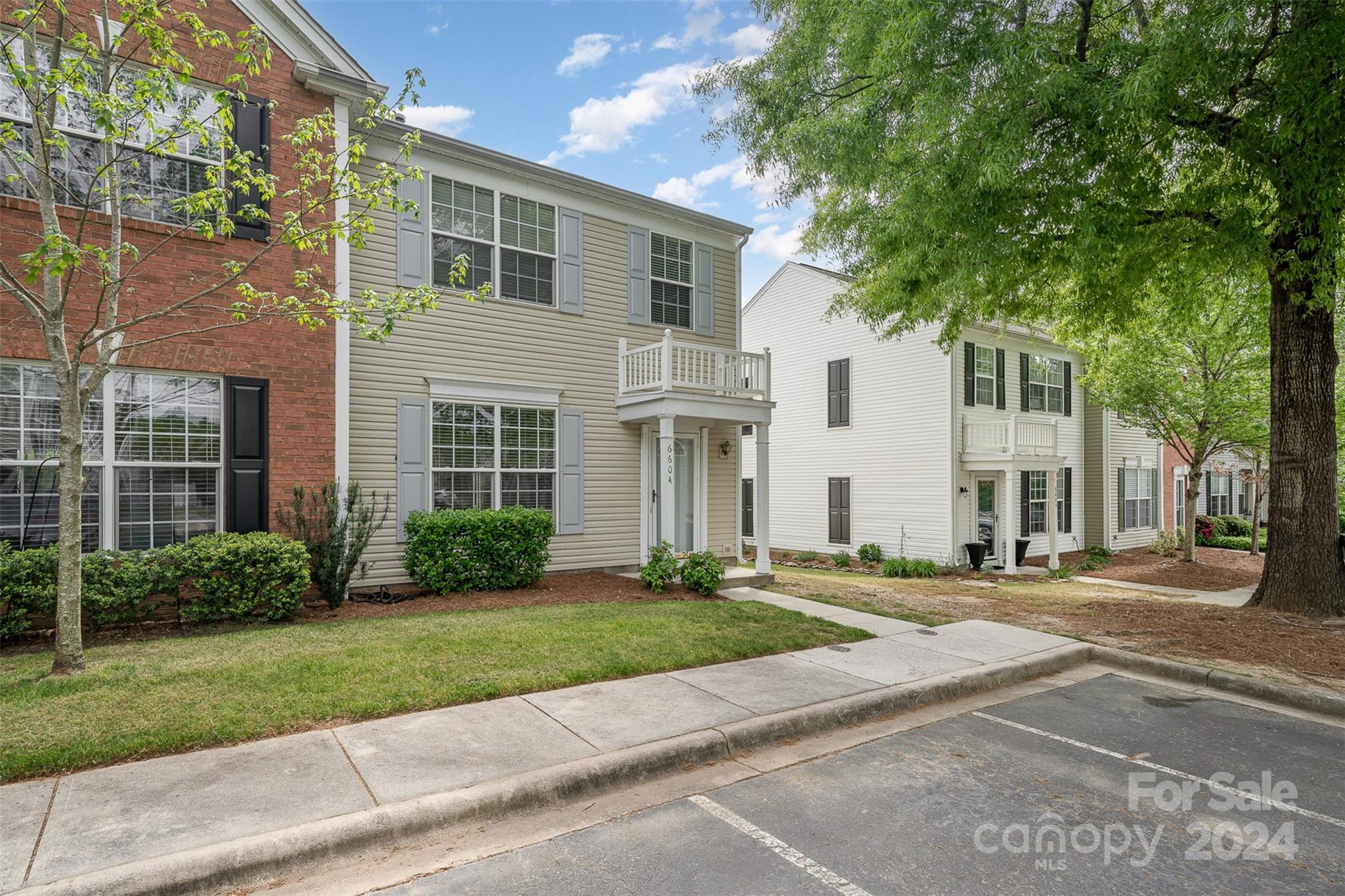 6604 Rothchild Drive Charlotte, NC 28270 - Photo 2 of 32 front view of a brick house with a yard