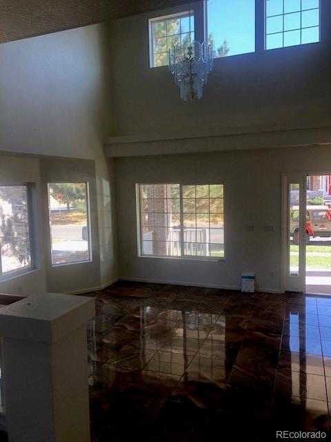 Undisclosed Address Commerce City, CO 80022 - Photo 2 of 12 a living room with furniture and a window