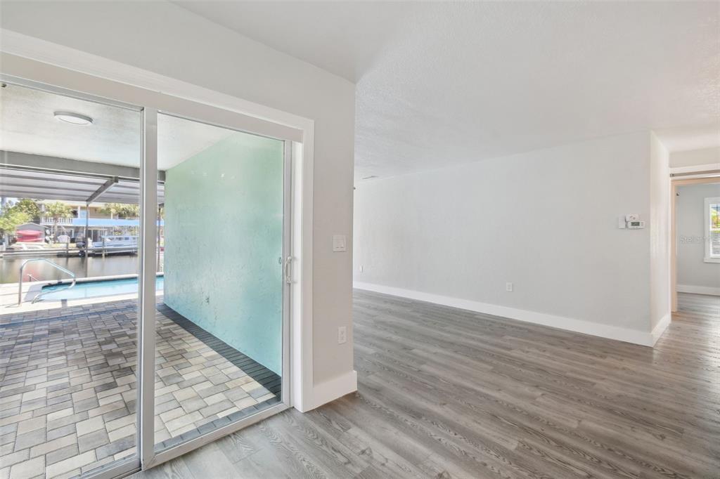 4482 Kingston Drive Hernando Beach, FL 34607 - Photo 11 of 49 a view of hallway with wooden floor