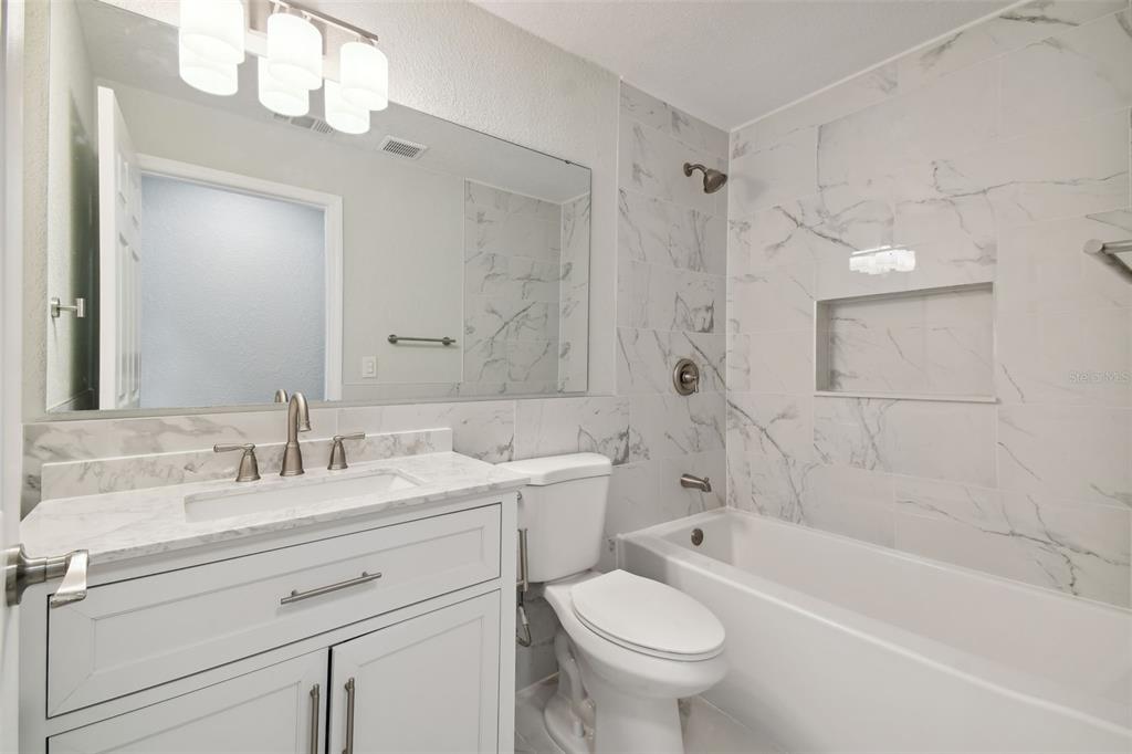 4482 Kingston Drive Hernando Beach, FL 34607 - Photo 31 of 49 a bathroom with a sink a toilet and a bathtub