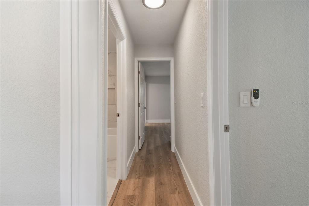 4482 Kingston Drive Hernando Beach, FL 34607 - Photo 34 of 49 a view of a hallway with wooden floor