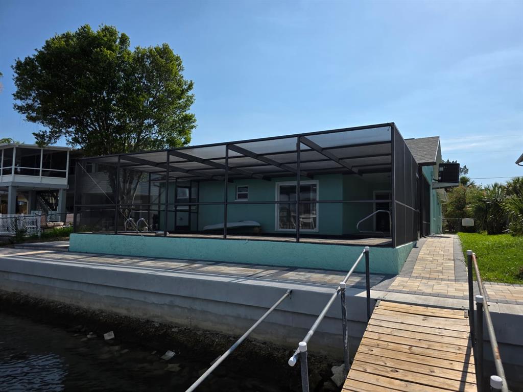 4482 Kingston Drive Hernando Beach, FL 34607 - Photo 42 of 49 a front view of a house with a yard