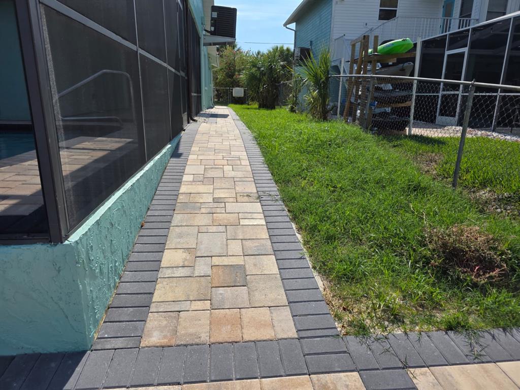 4482 Kingston Drive Hernando Beach, FL 34607 - Photo 44 of 49 a view of a backyard with wooden floor