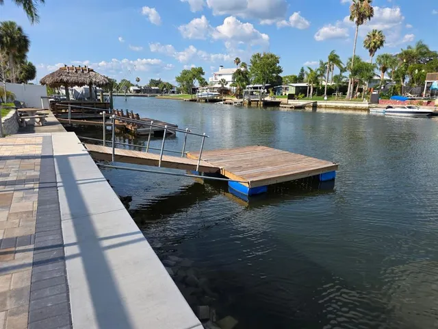 a view of swimming pool with outdoor seating