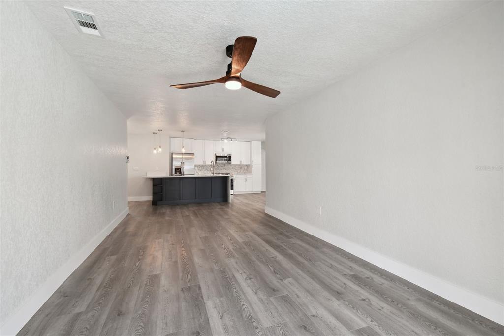 4482 Kingston Drive Hernando Beach, FL 34607 - Photo 9 of 49 a view of workspace with wooden floor