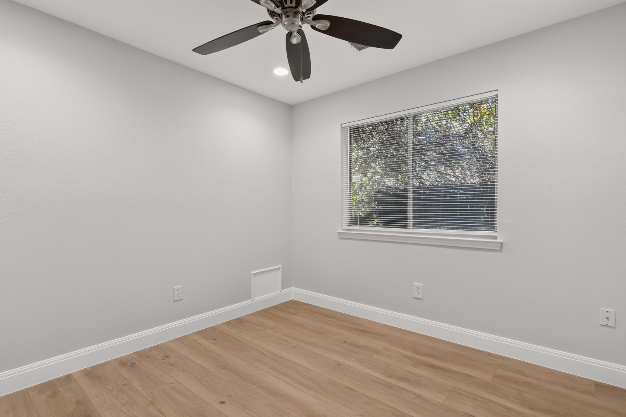 13536 Anarosa Loop Austin, TX 78727 - Photo 24 of 31 The second bedroom offers flexible space with fresh 2024 wall paint, making it a cozy room for family members or weekend guests