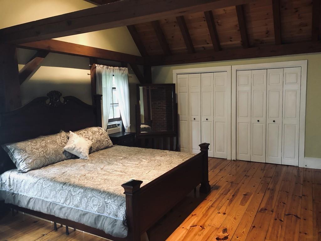 451 Carpenter Road Northbridge, MA 01588 - Photo 13 of 28 a bedroom with a bed and a dresser