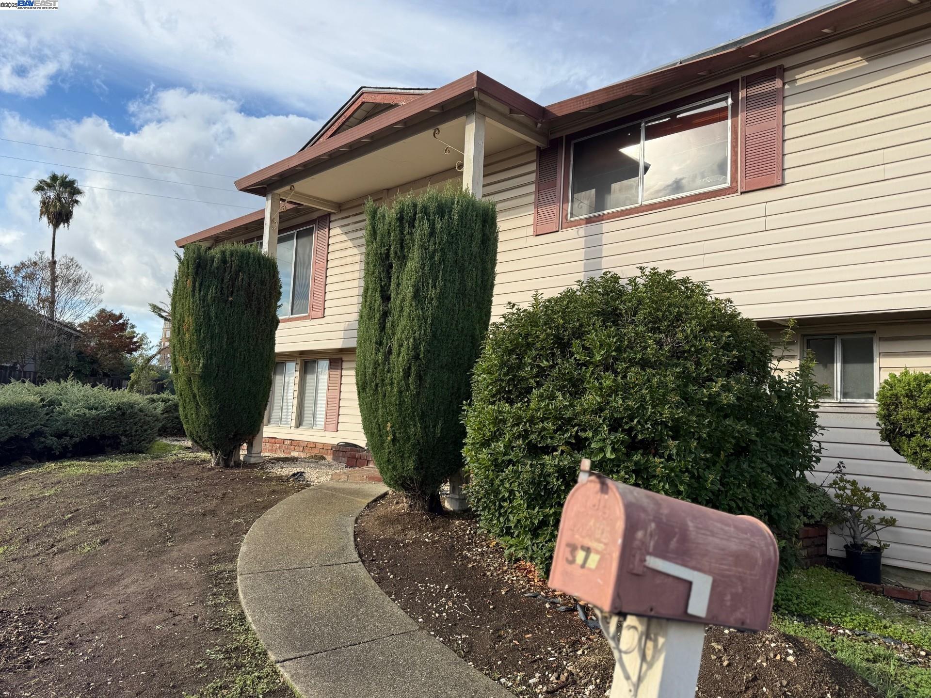 a front view of a house with garden