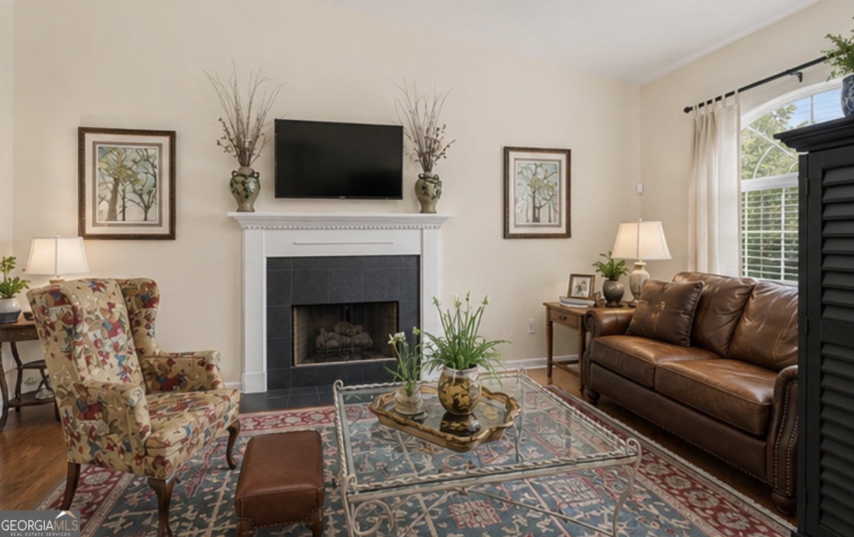 138 Brookfair Lane Leesburg, GA 31763 - Photo 6 of 30 a living room with furniture a flat screen tv and a fireplace