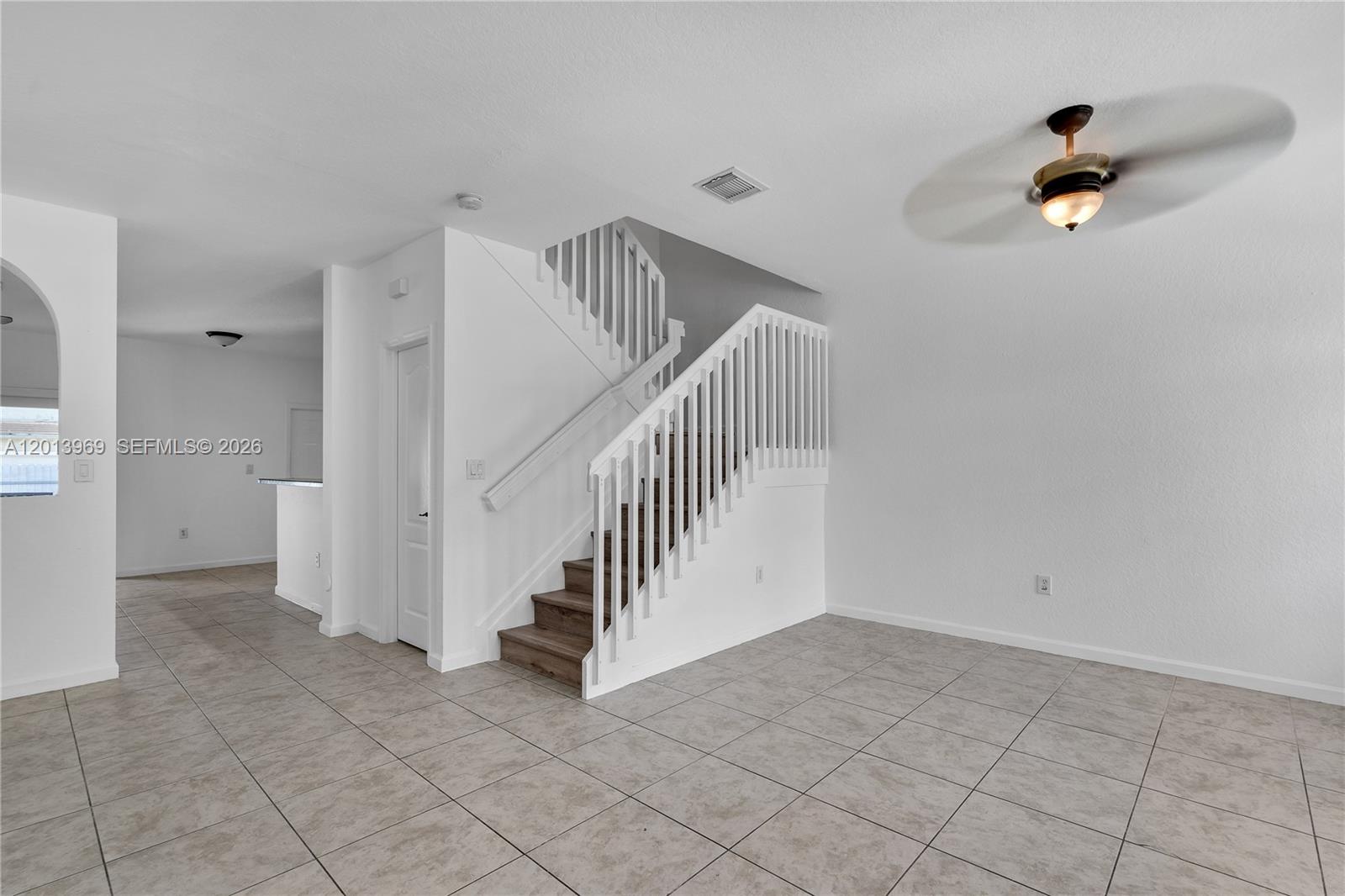 14044 Southwest 273rd Lane, Unit 14044 Homestead, FL 33032 - Photo 7 of 44 a view of an entryway with stairs