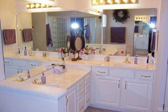 112 Jersey Ridge Road Cary, NC 27518 - Photo 8 of 10 His and Her vanities in master bath. Glass block shower wall not shown