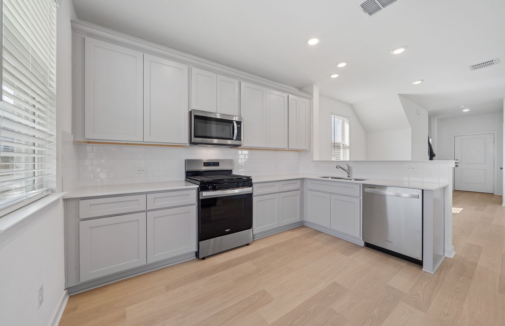608 Rubber Tree Way Buda, TX 78610 - Photo 4 of 29 a kitchen with a sink appliances and cabinets
