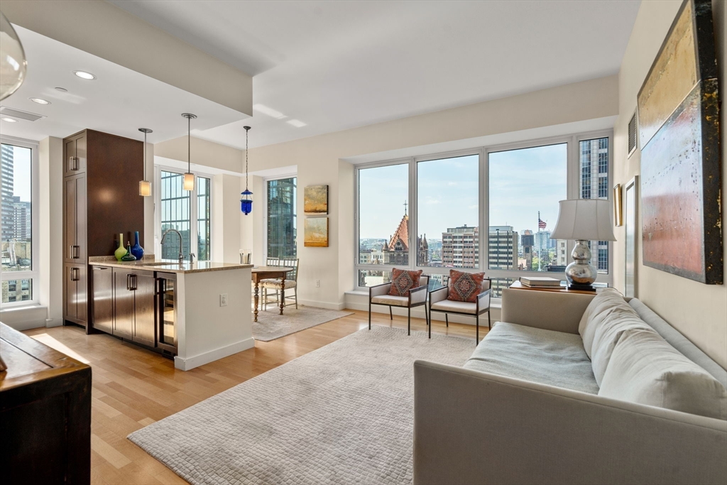 400 Stuart Street, Unit 15J Boston, MA 02116 - Photo 1 of 12 a living room with furniture and a large window