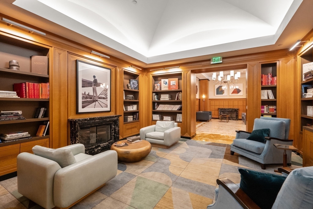 400 Stuart Street, Unit 15J Boston, MA 02116 - Photo 11 of 12 a living room with furniture a lamp and a large window