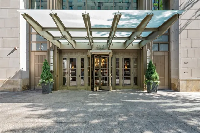 a view of a porch with furniture and front door