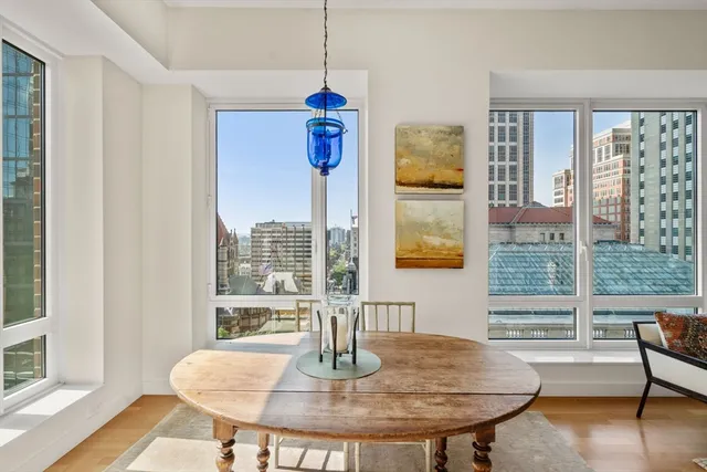 a view of a dining room with furniture window and wooden floor