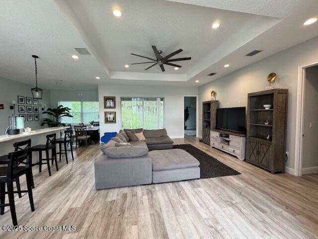 4235 Navel Street Cocoa, FL 32926 - Photo 3 of 24 a living room with furniture and a flat screen tv