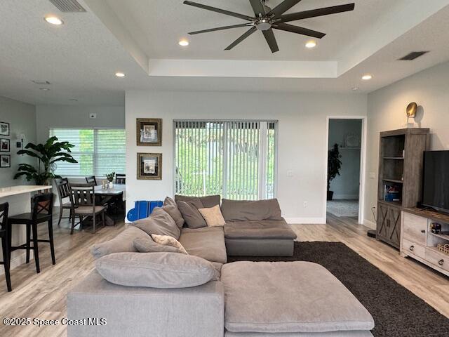 4235 Navel Street Cocoa, FL 32926 - Photo 4 of 24 a living room with furniture and a flat screen tv
