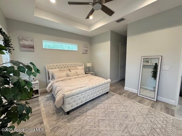 4235 Navel Street Cocoa, FL 32926 - Photo 8 of 24 a bedroom with a large bed and a chandelier