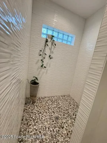 a bathroom with a sink and a shower