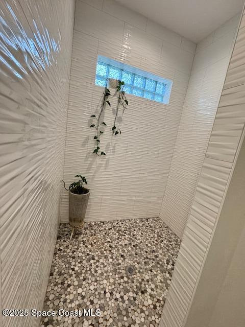 4235 Navel Street Cocoa, FL 32926 - Photo 10 of 24 a bathroom with a sink and a shower