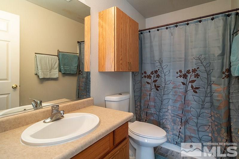 17726 Fortune Court Reno, NV 89508 - Photo 12 of 14 a bathroom with a sink toilet and shower