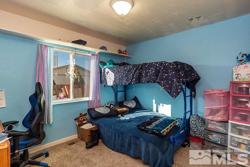 17726 Fortune Court Reno, NV 89508 - Photo 9 of 14 a bedroom with bed and a window