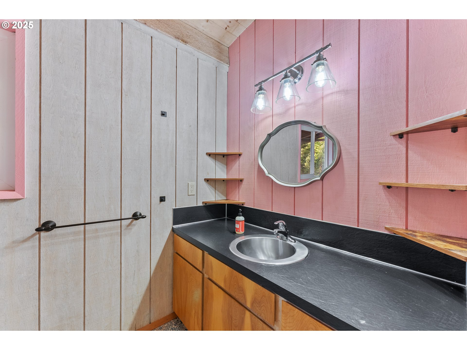 97639 Marina Heights Loop Brookings, OR 97415 - Photo 11 of 27 a bathroom with a sink vanity granite and a mirror