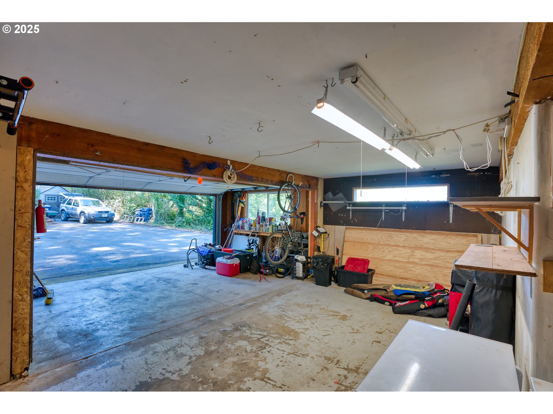 97639 Marina Heights Loop Brookings, OR 97415 - Photo 16 of 27 a view of a garage with a lot of stuff