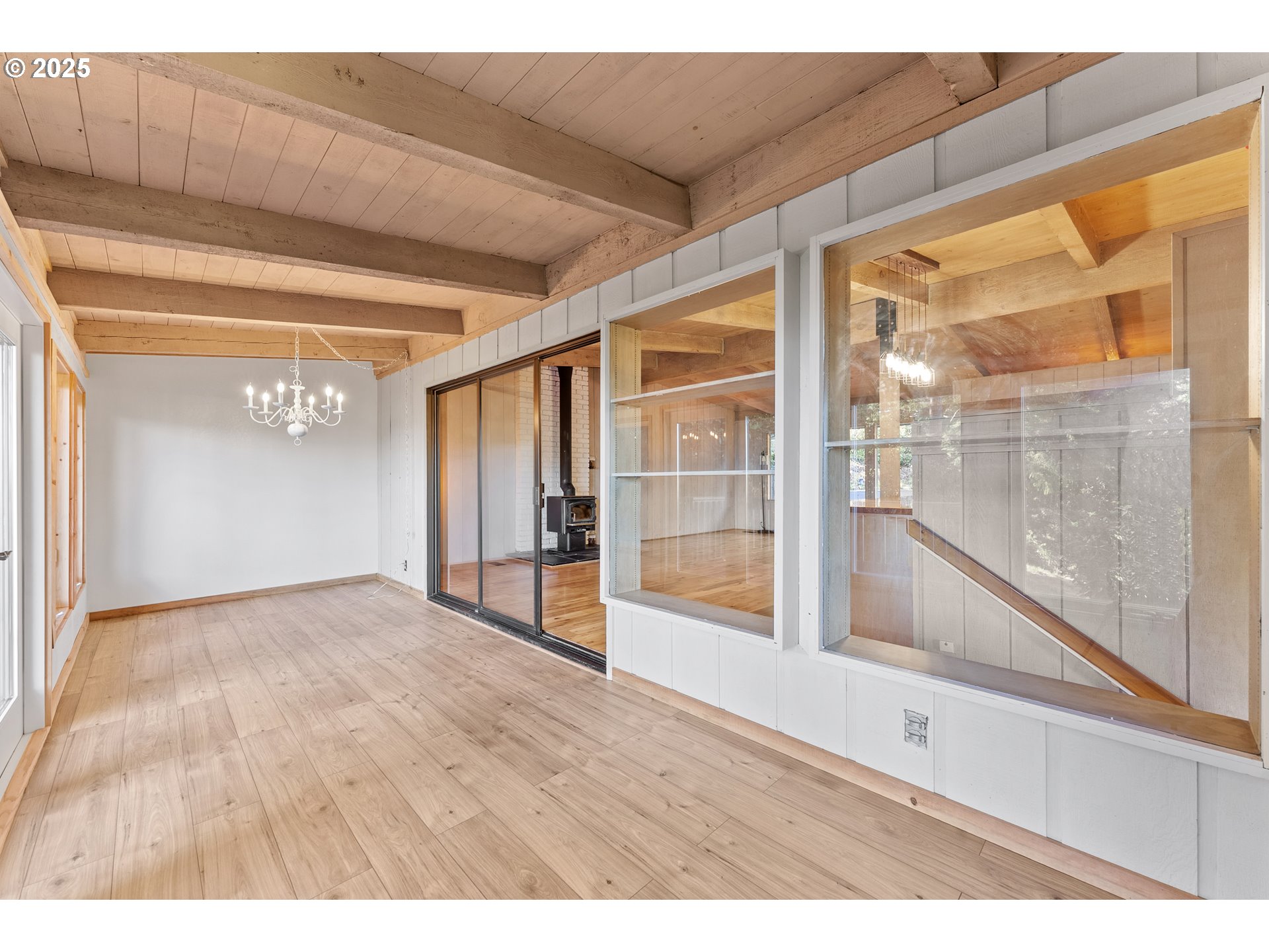 97639 Marina Heights Loop Brookings, OR 97415 - Photo 19 of 27 a view of an empty room with wooden floor and a window