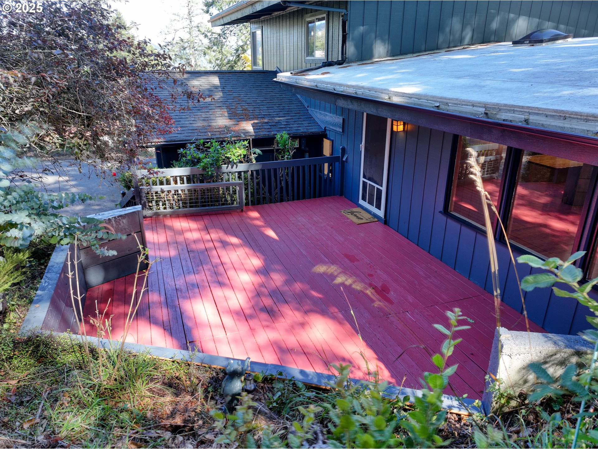 97639 Marina Heights Loop Brookings, OR 97415 - Photo 21 of 27 a backyard of a house with lots of green space and wooden fence