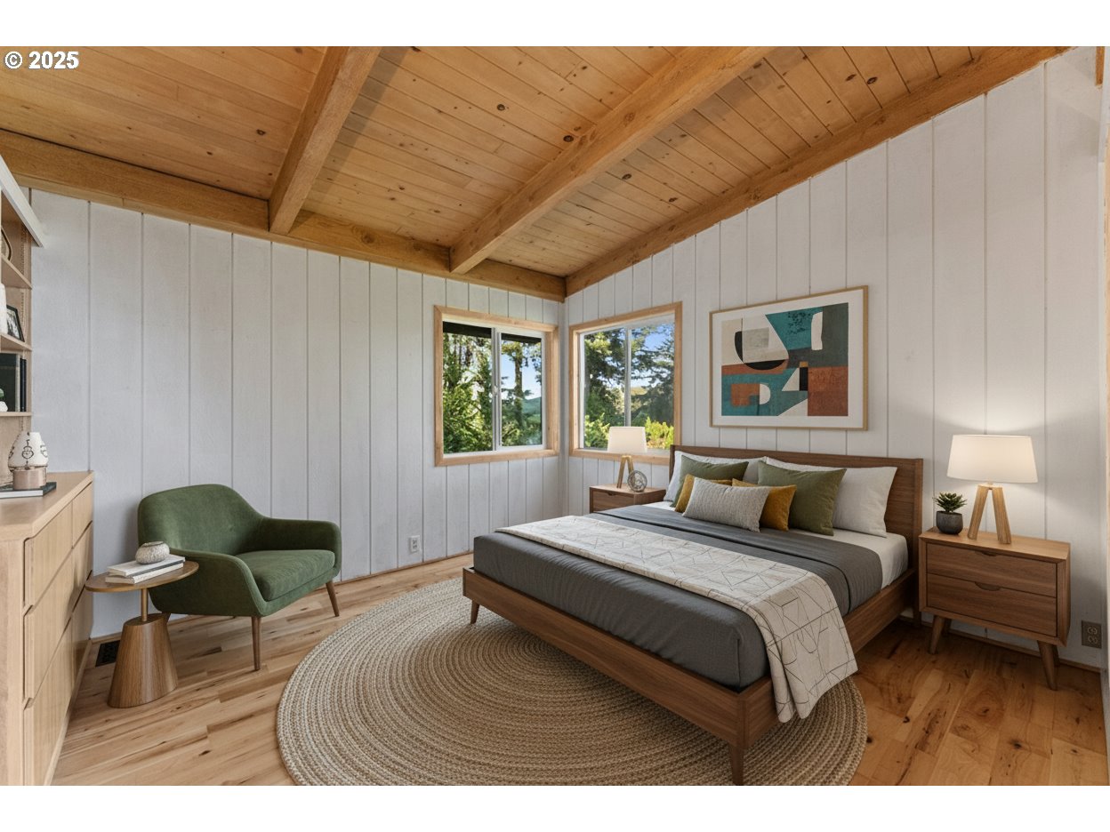 97639 Marina Heights Loop Brookings, OR 97415 - Photo 26 of 27 a bedroom with a bed a table and chair