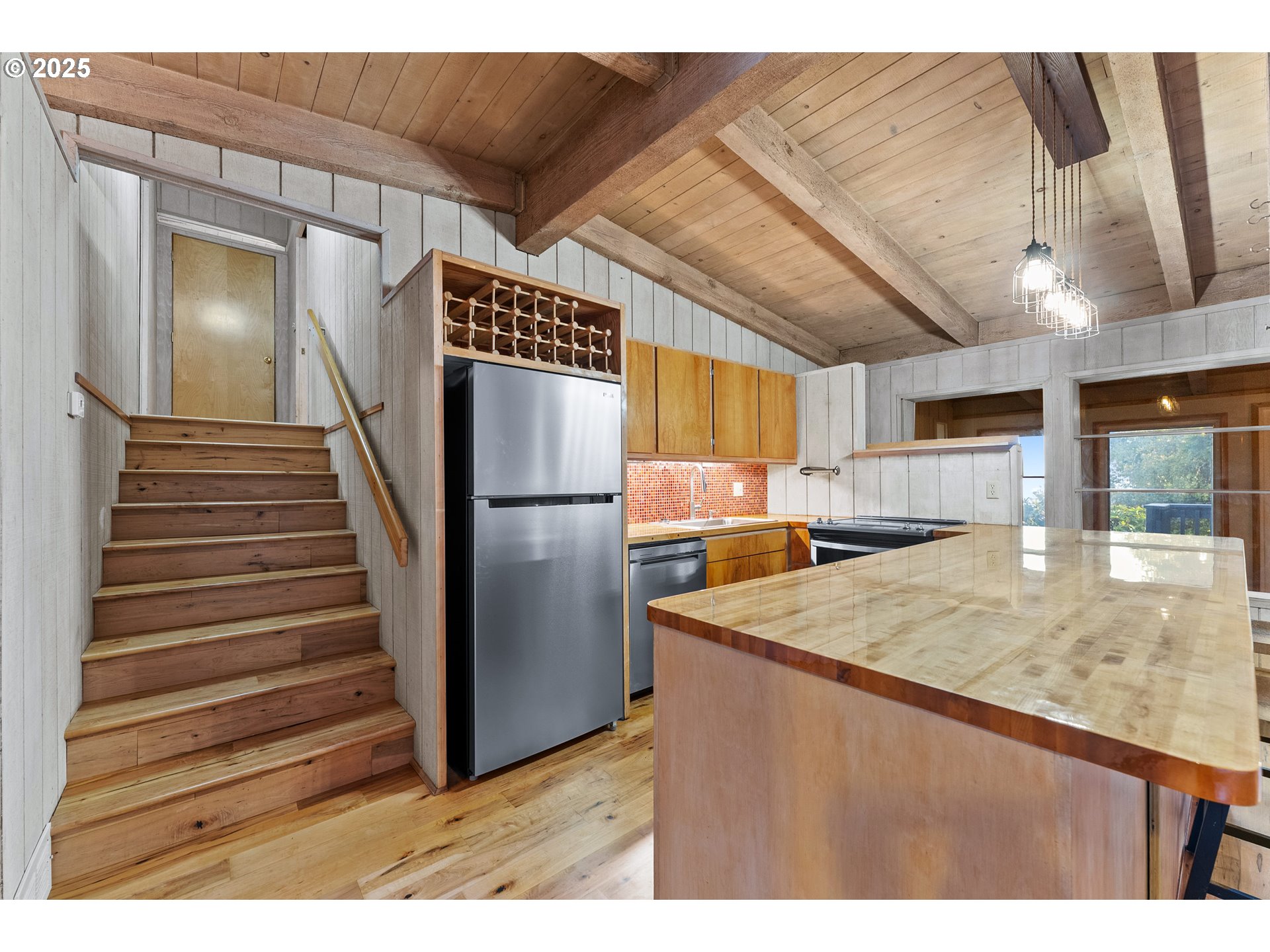 97639 Marina Heights Loop Brookings, OR 97415 - Photo 3 of 27 a kitchen view with granite countertop a refrigerator and a sink